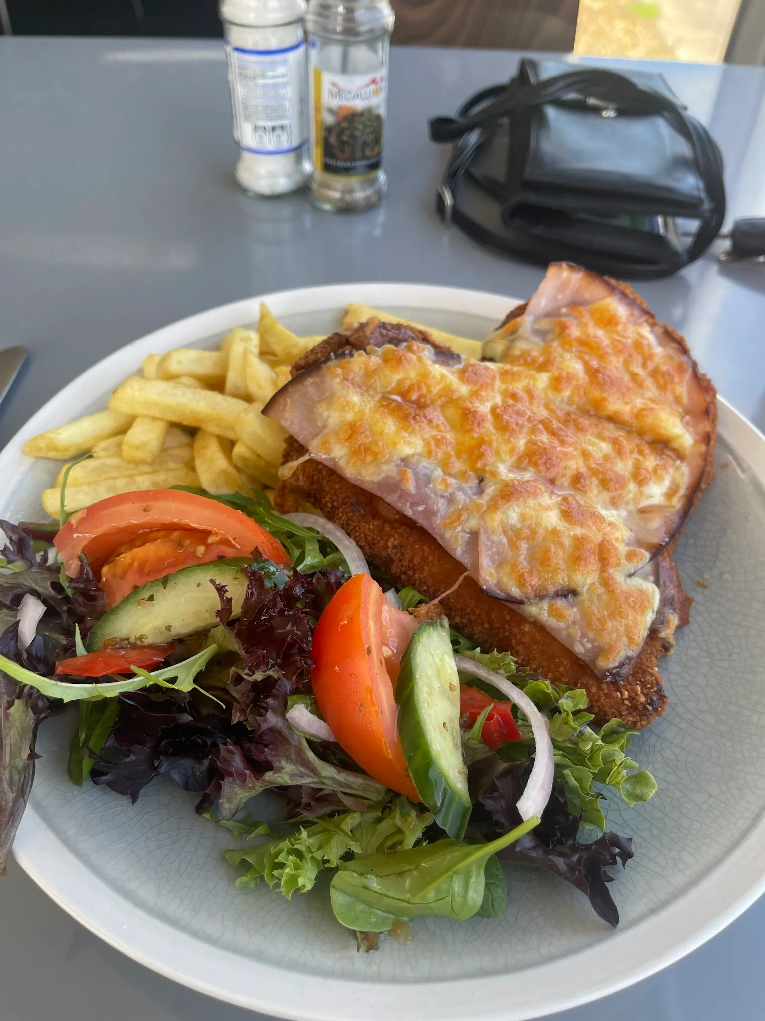 Chicken parmigiana with chips and garden salad
