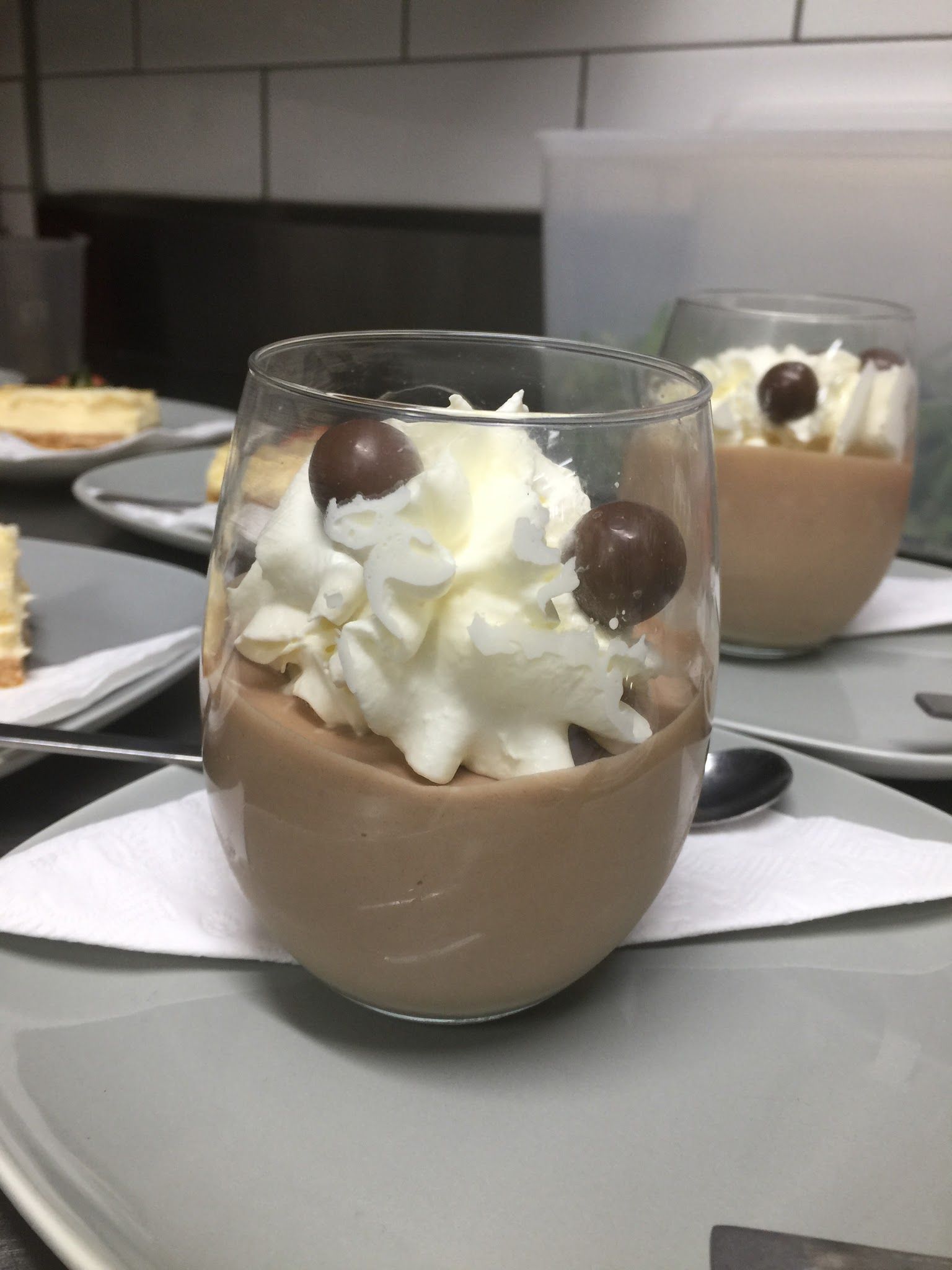 Mocha chocolate dessert in a glass topped with whipped cream
